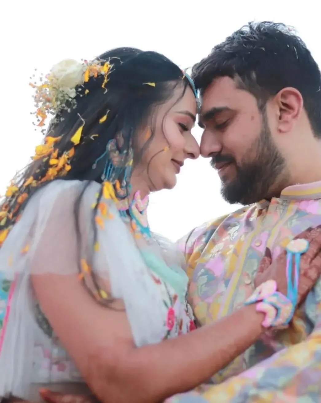Bride and groom forehead to forehead during the haldi