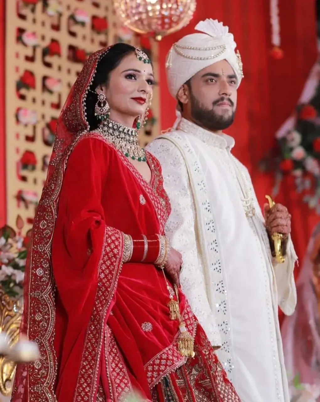 Bride and groom standing together at the wedding stage