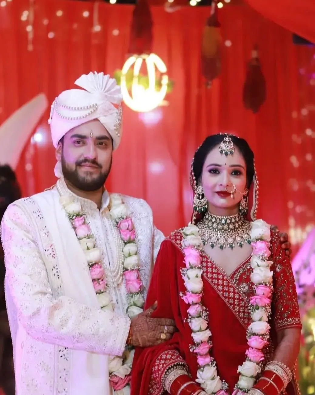 Bride and groom with varmalas at the wedding